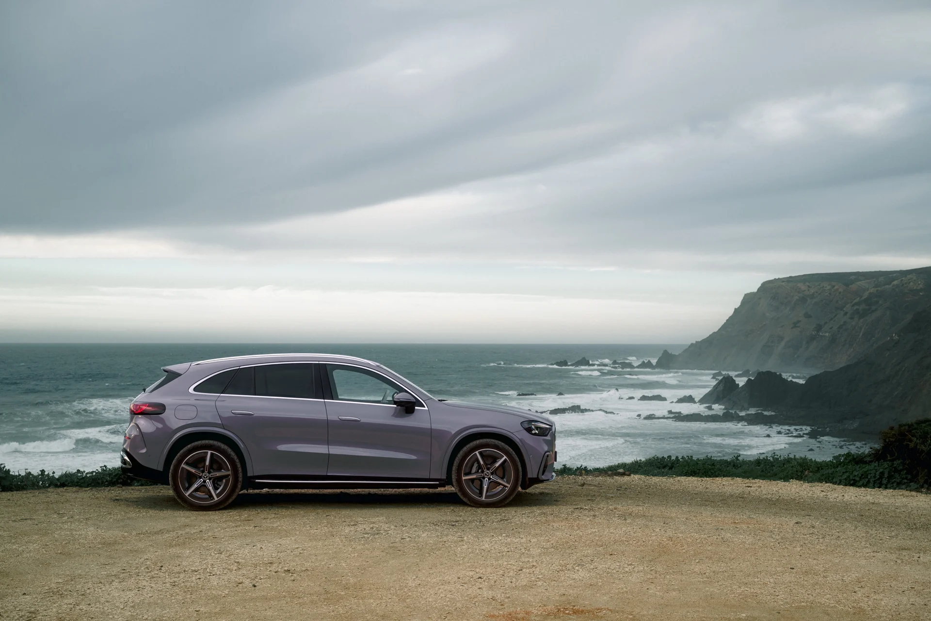 Electric Mercedes GLC parked on a clifftop, side view