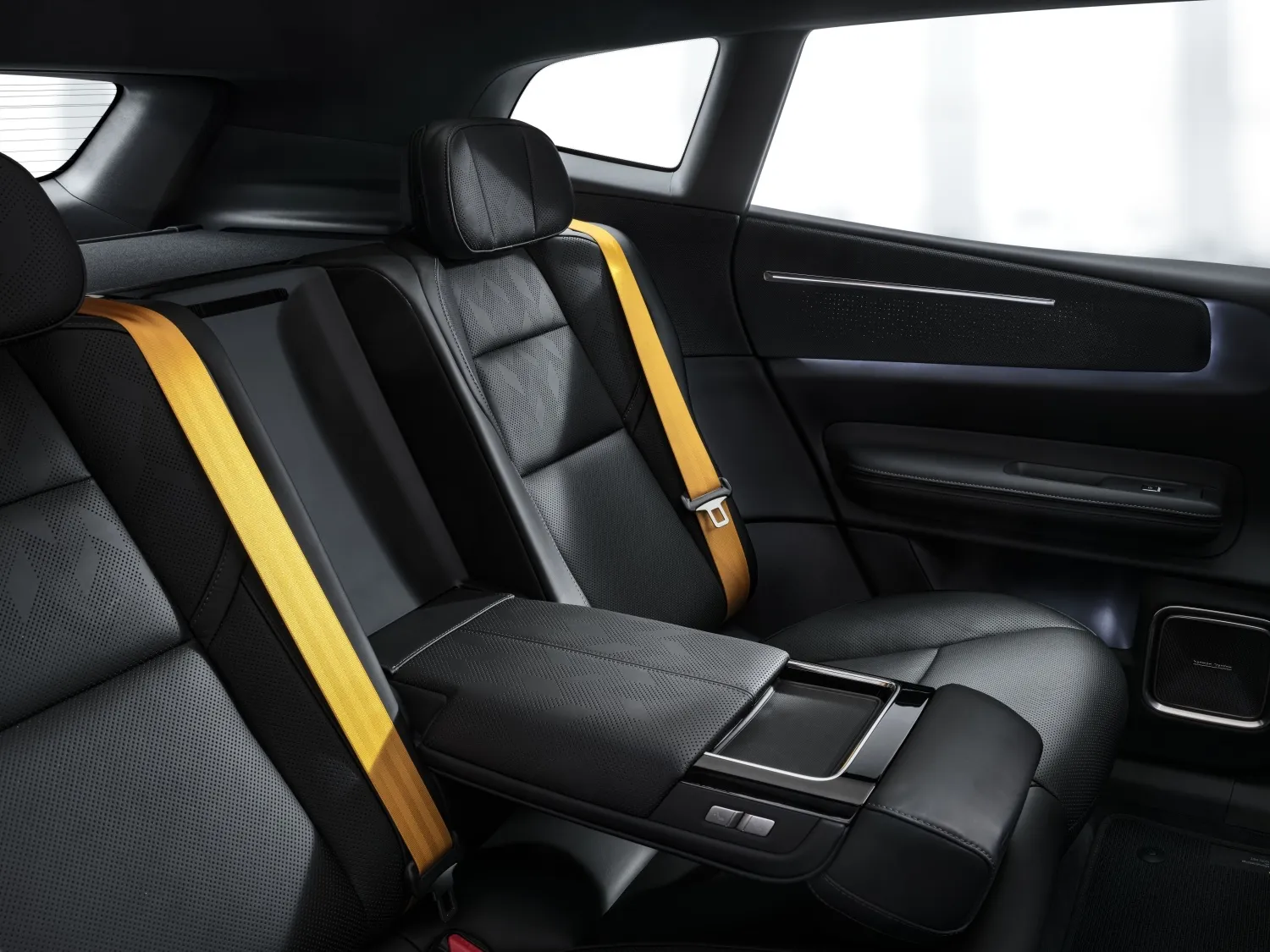Polestar 4 SUV rear seats with gold seatbelts