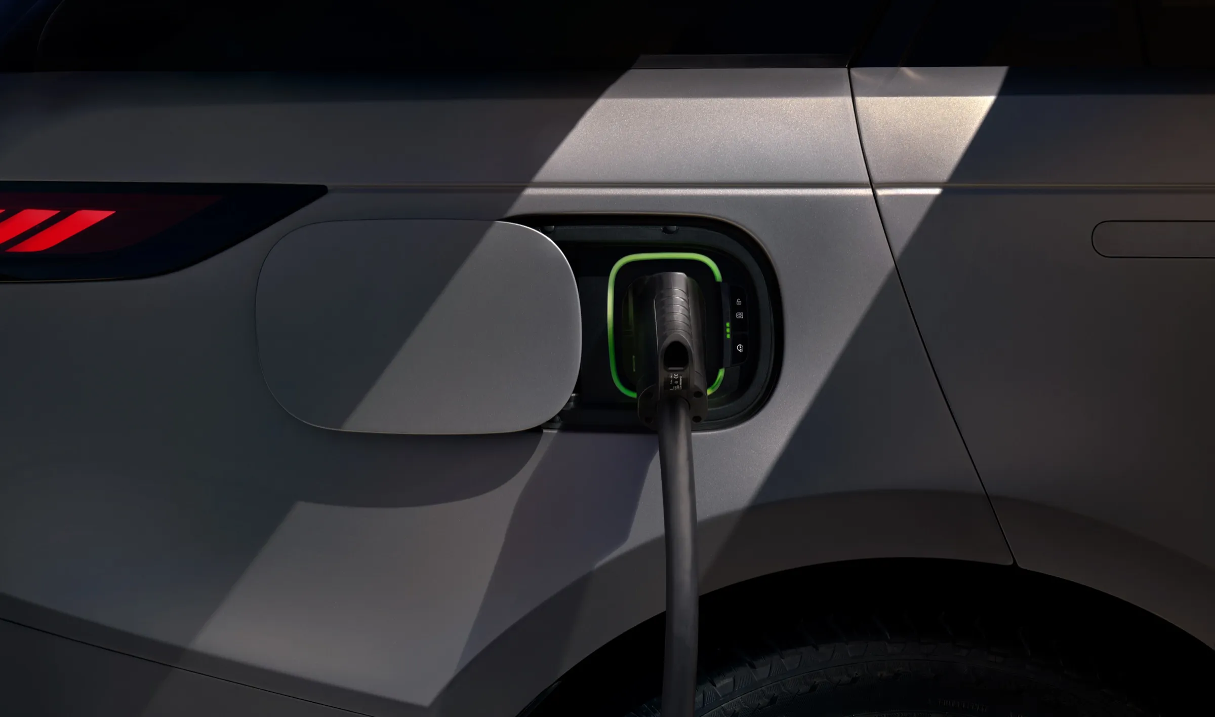 Range Rover Sport Electric plugged in at its charging port