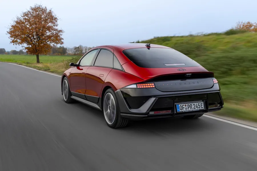 Rear view of the Hyundai Ioniq 6 N Line driving, showing the ducktail spoiler