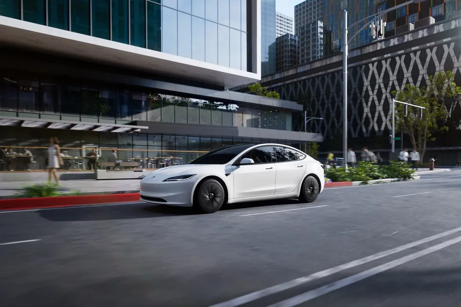 White Tesla Model 3 on a city street